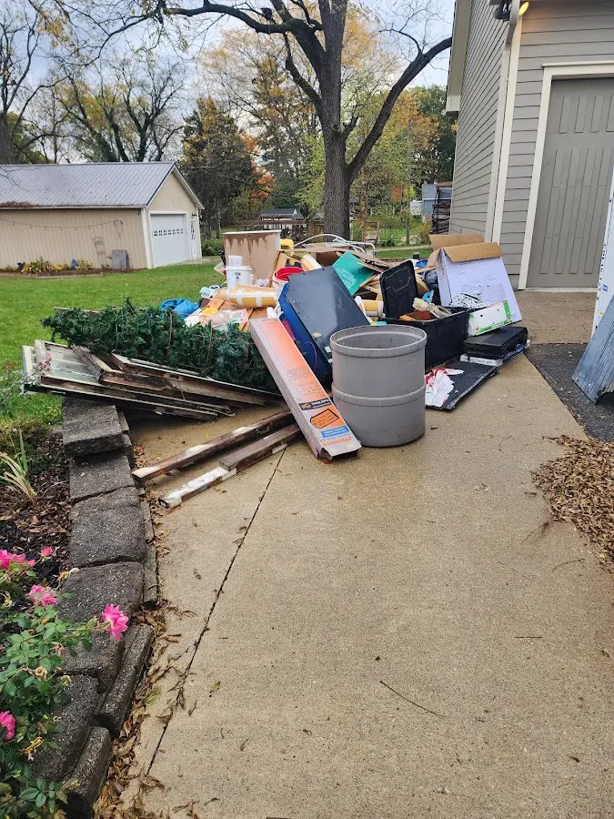 Dumpster being loaded with debris for 12 Yard Dumpster Rental in Fishkill